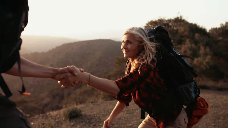 couple hiking at sunrise